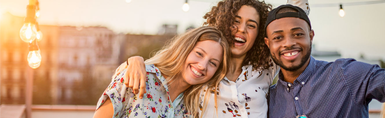 three friends taking a group photo